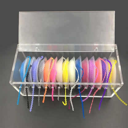 High-quality acrylic Dental Power Chain Box with multi-spool dispenser for orthodontic elastic chains; transparent dental clinic organizer for braces accessories available at DentalNeeds.pk.