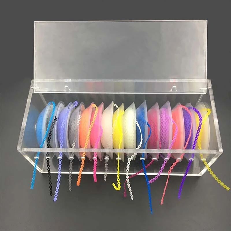 High-quality acrylic Dental Power Chain Box with multi-spool dispenser for orthodontic elastic chains; transparent dental clinic organizer for braces accessories available at DentalNeeds.pk.