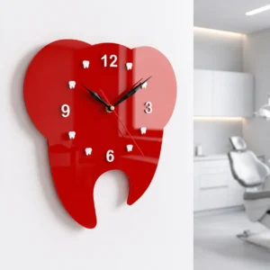 Red tooth wall clock hanging in a dental operatory room for precise timekeeping
